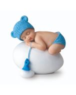 Figura niño bebé azul durmiendo sobre huevo,7,5x8cm.