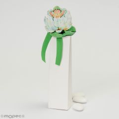 Wooden clip baby on white flower with 3 chocolate dragées