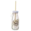 Glass bottle with beige straw confetti and 12 candies